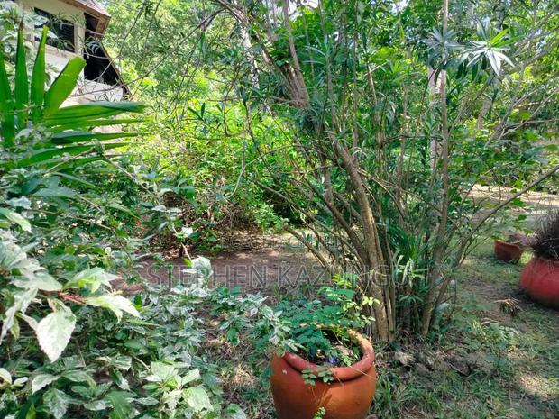 A 1.3/4 Acres Beach Plot on Sale in Diani Beach.