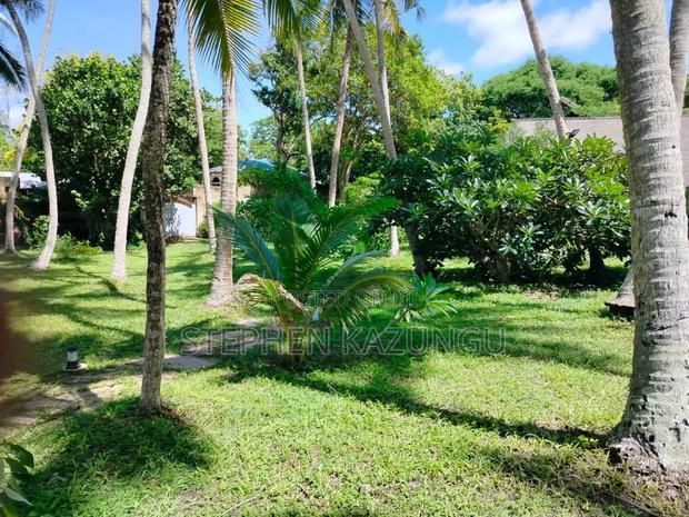 A 1.3/4 Acres Beach Plot on Sale in Diani Beach.