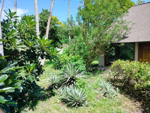 A 1.3/4 Acres Beach Plot on Sale in Diani Beach.