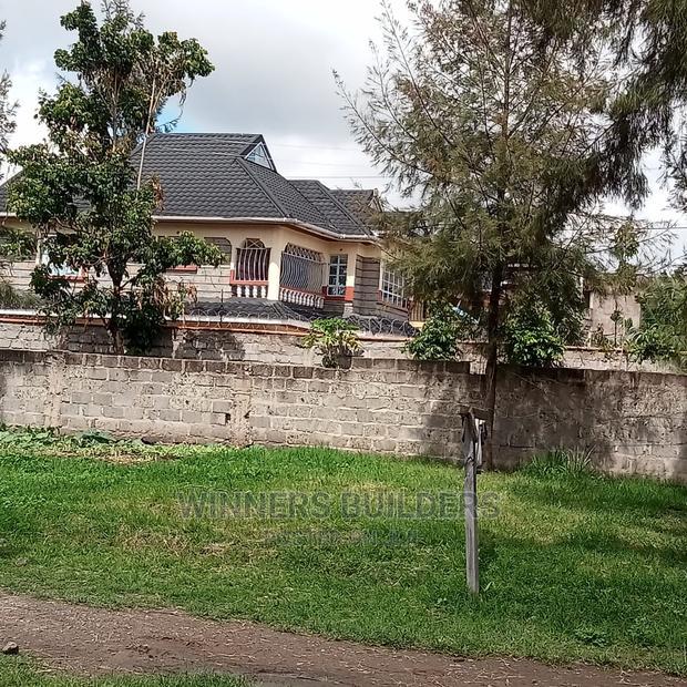 100 by 100 Plot for Sale at Utawala