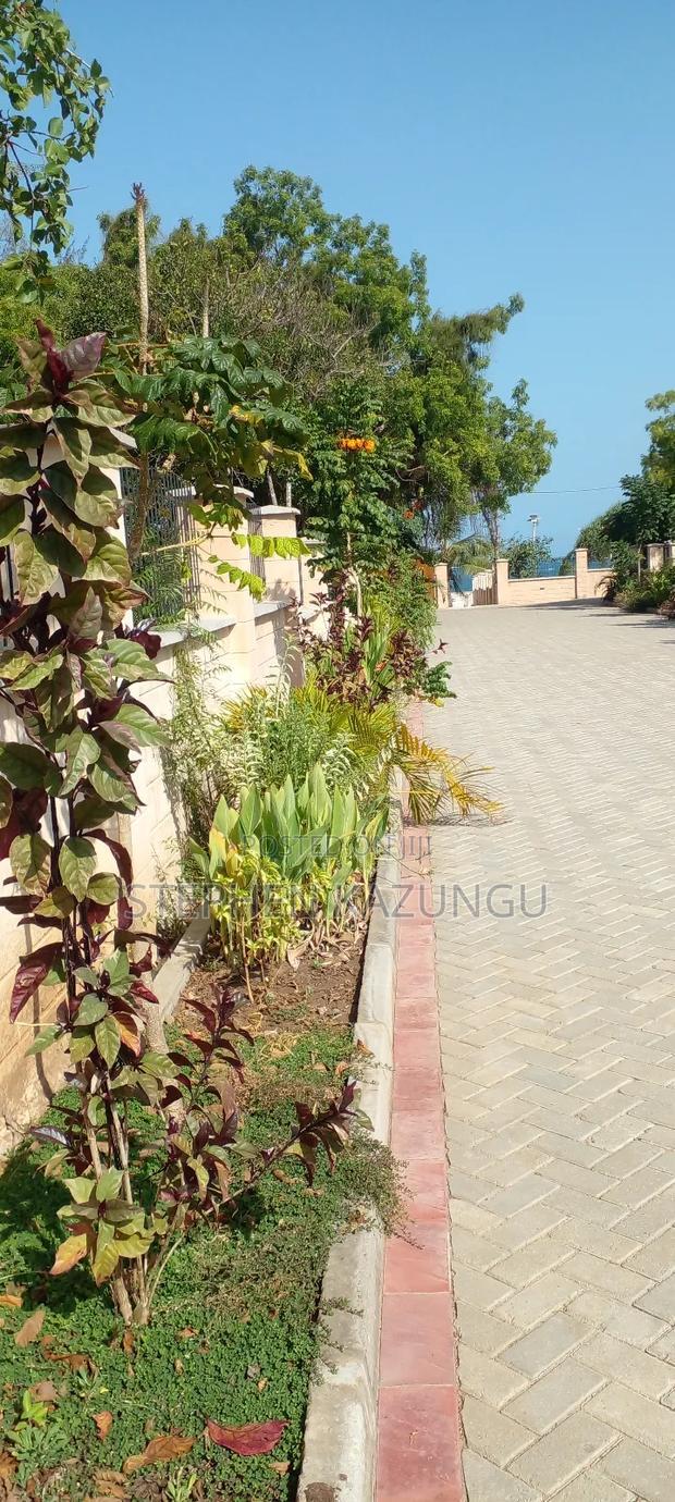 On Sale 1/2 Acre Beach Plot With House in It.