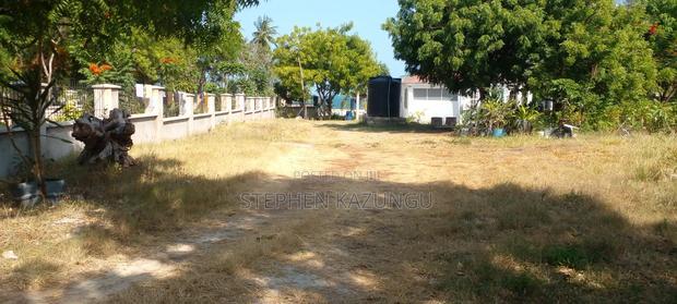 On Sale 1/2 Acre Beach Plot With House in It.