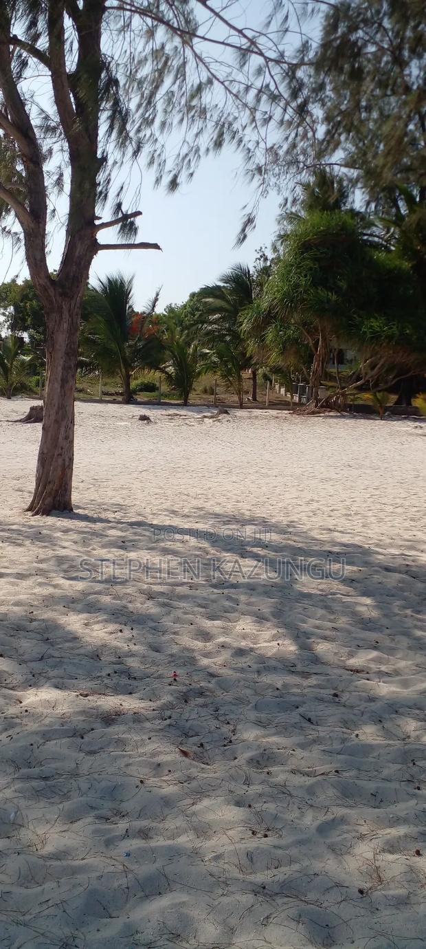 On Sale 1/2 Acre Beach Plot With House in It.
