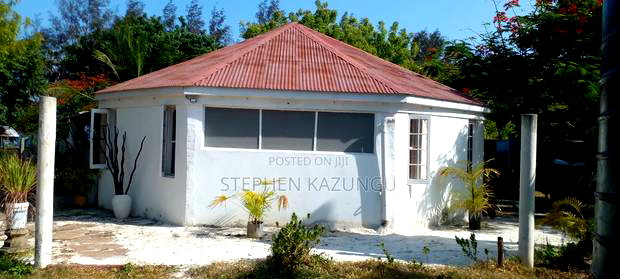 On Sale 1/2 Acre Beach Plot With House in It.