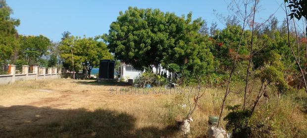 On Sale 1/2 Acre Beach Plot With House in It.