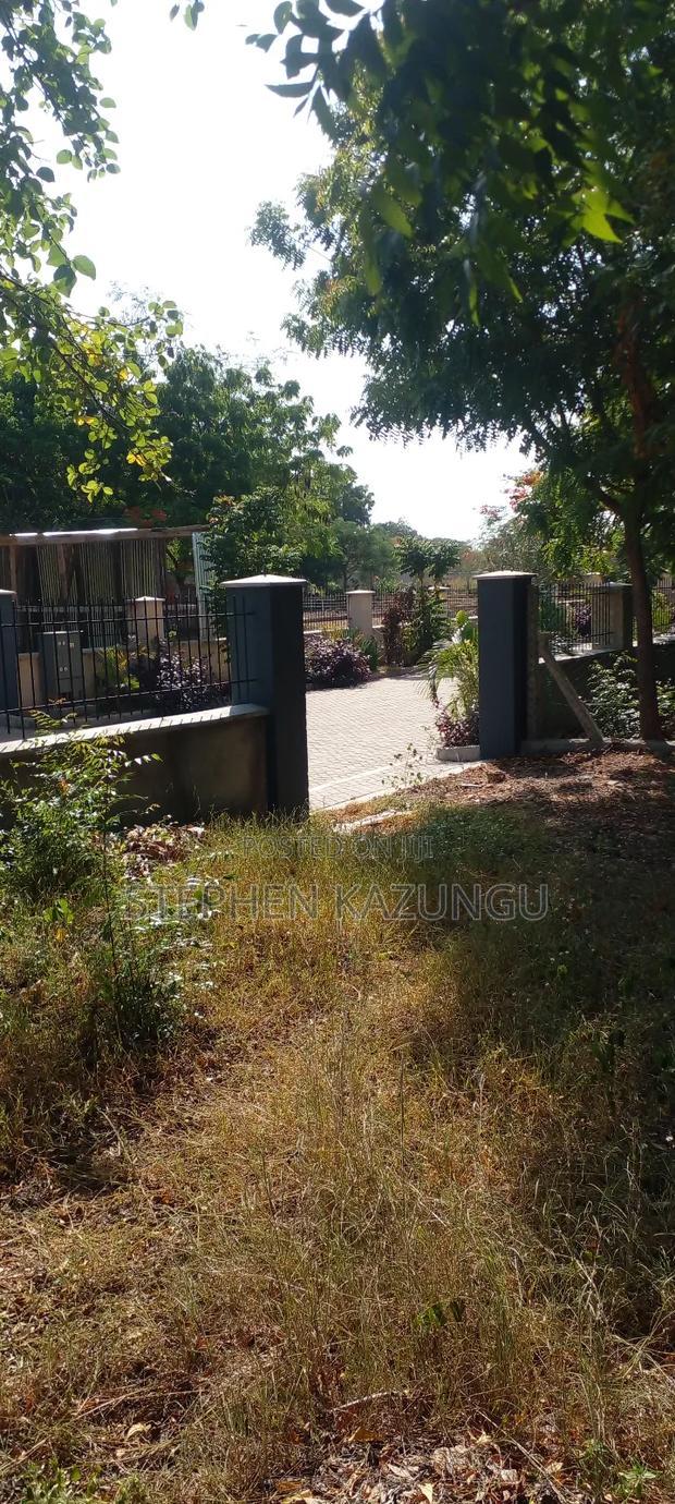 On Sale 1/2 Acre Beach Plot With House in It.
