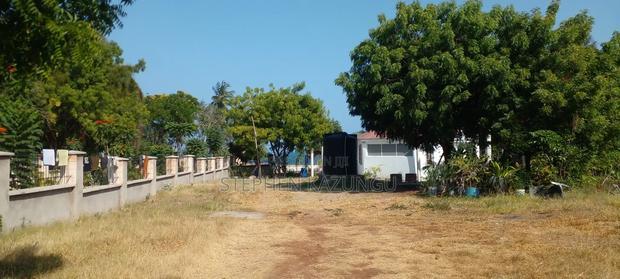 On Sale 1/2 Acre Beach Plot With House in It.