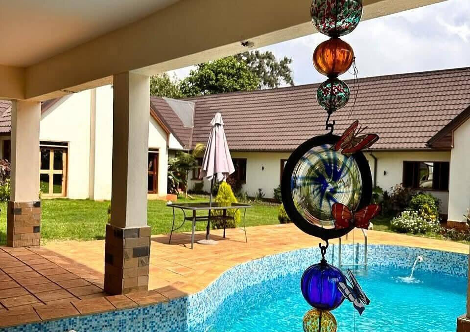 4-Bed Ensuite Townhouse on Half-Acre with Shared Pool – Karen Miotoni