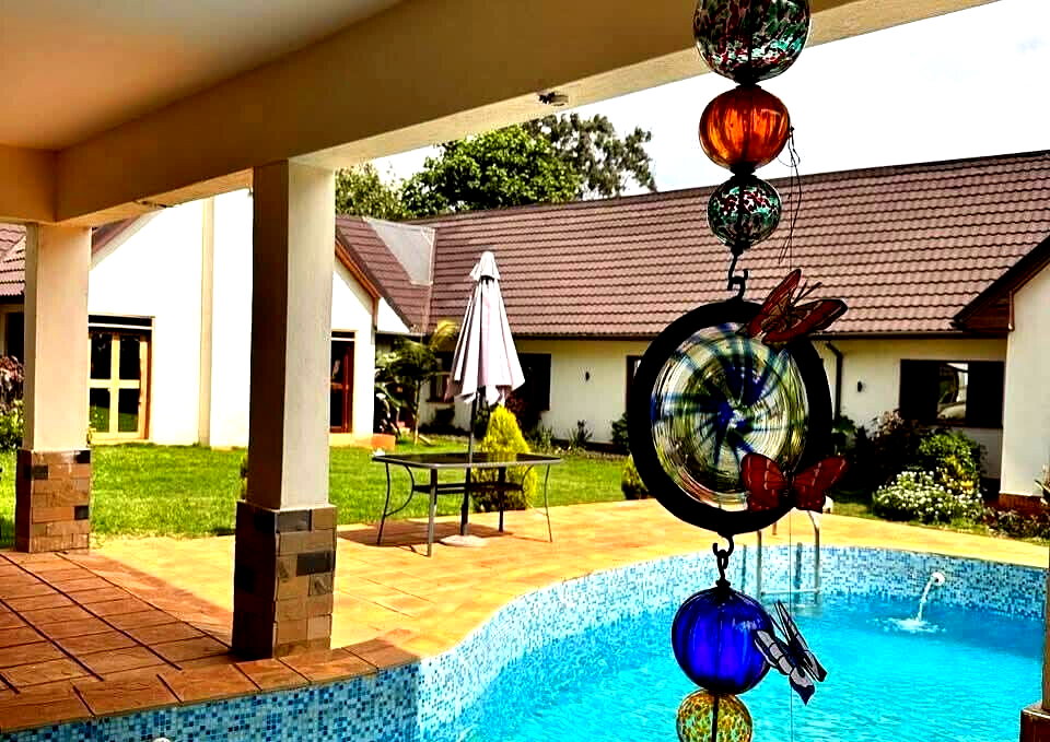 4-Bed Ensuite Townhouse on Half-Acre with Shared Pool – Karen Miotoni