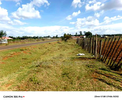 1/2 Acre Kiplombe Touching Tarmac With Title - Image 1